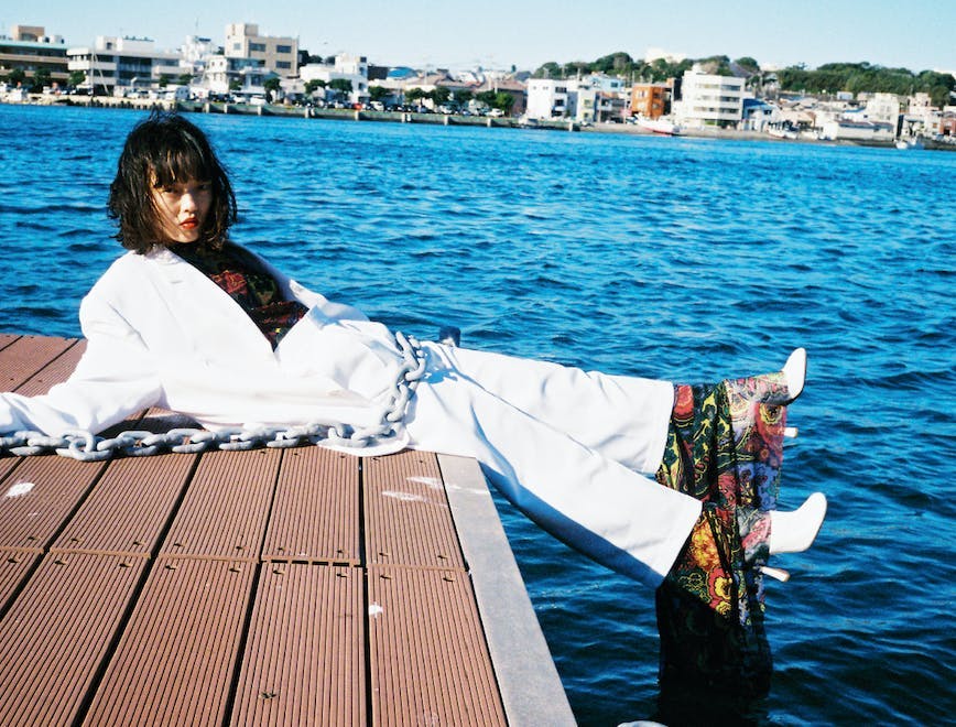 clothing apparel person human waterfront water robe fashion pier dock
