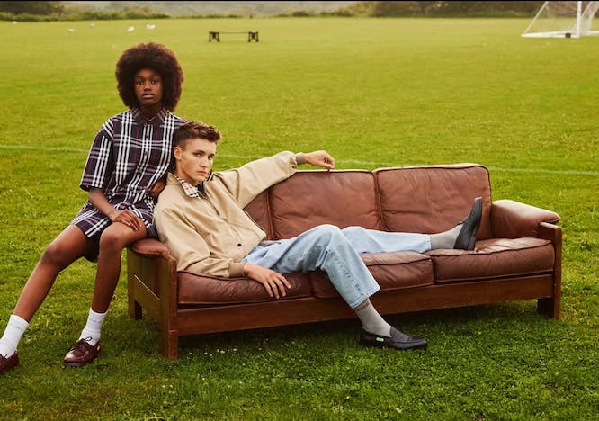 couch furniture person human grass plant hair