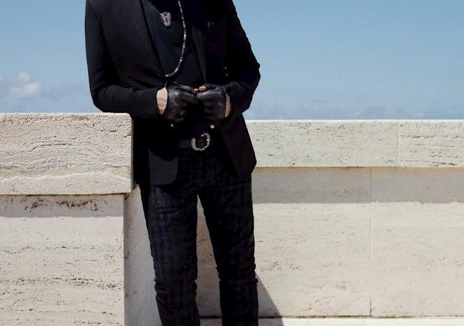clothing suit overcoat coat sunglasses accessories person blazer jacket footwear