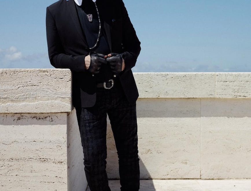 clothing suit overcoat coat sunglasses accessories person blazer jacket footwear