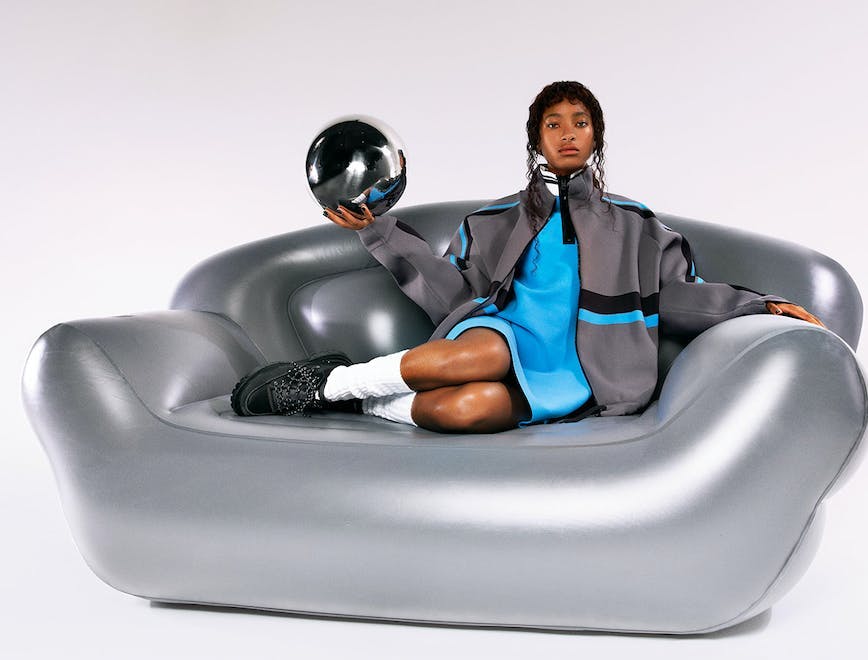 helmet clothing apparel person human inflatable couch furniture