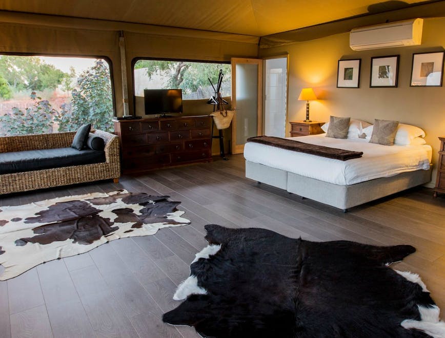 home decor rug interior design indoors floor flooring wood living room furniture monitor