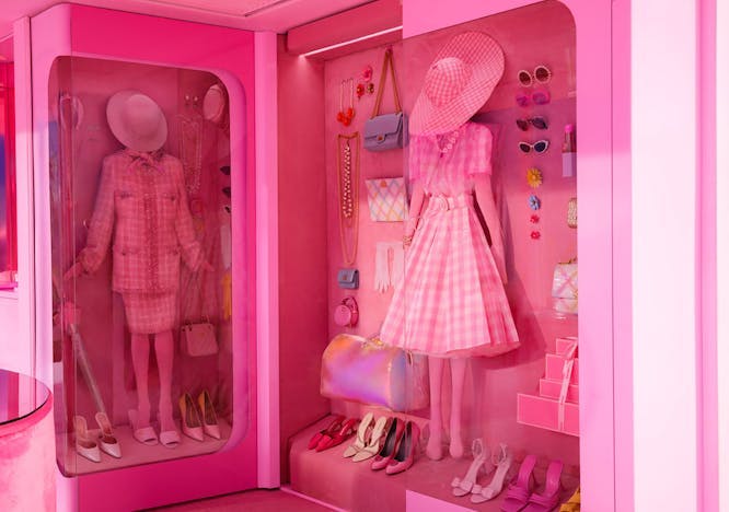boutique shop clothing coat furniture person indoors bag handbag walk-in closet